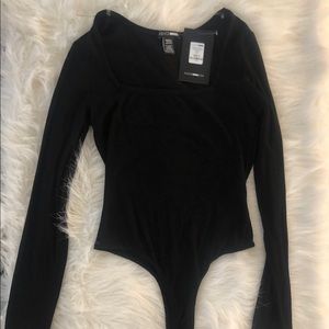 Brand new, black body suit!